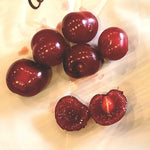 Carmine Jewel Dwarf Sour Cherries on a table.