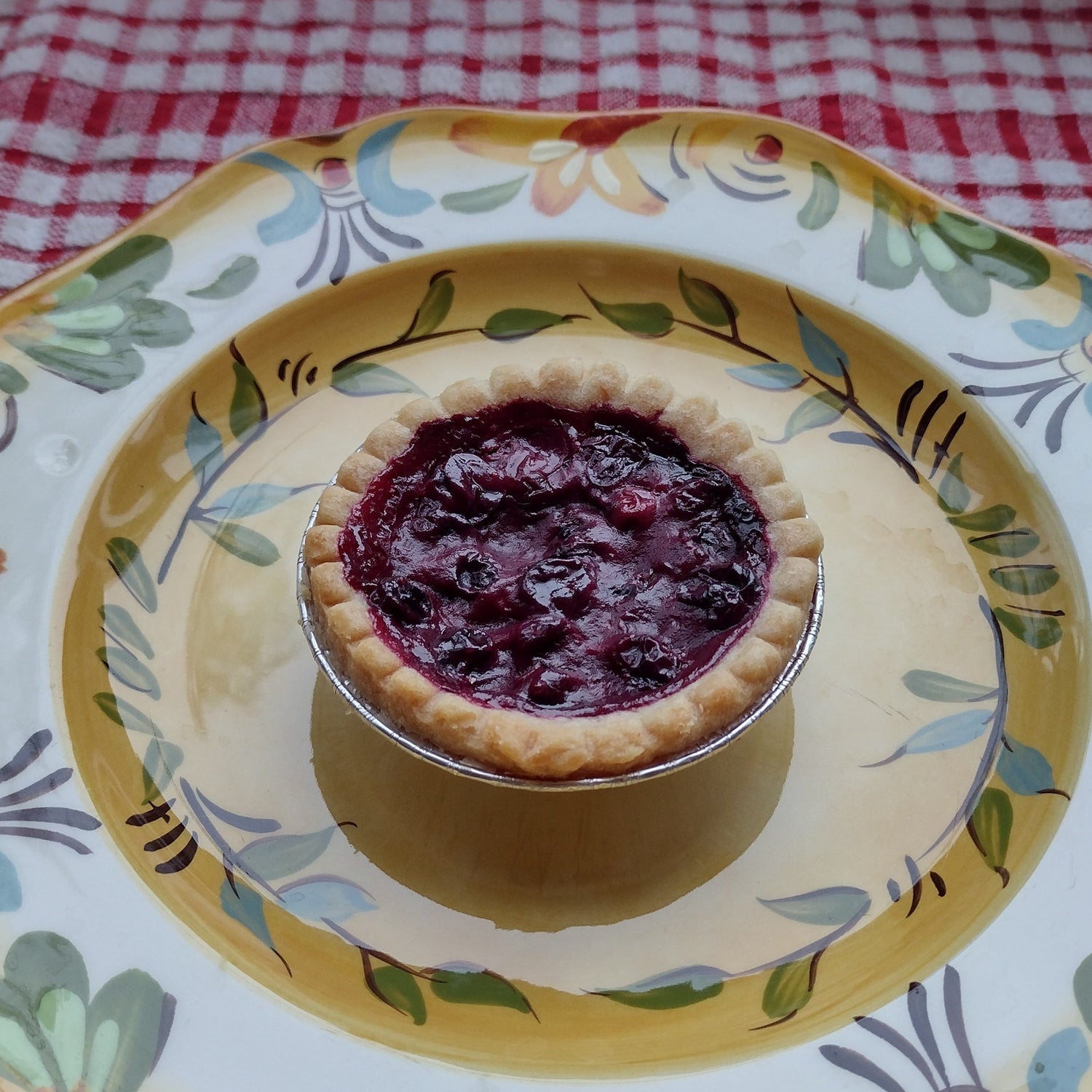Blueberry tart on a plate.