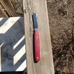 Grafting Knife sitting on a railing