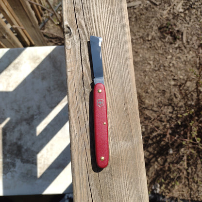 Grafting Knife sitting on a railing