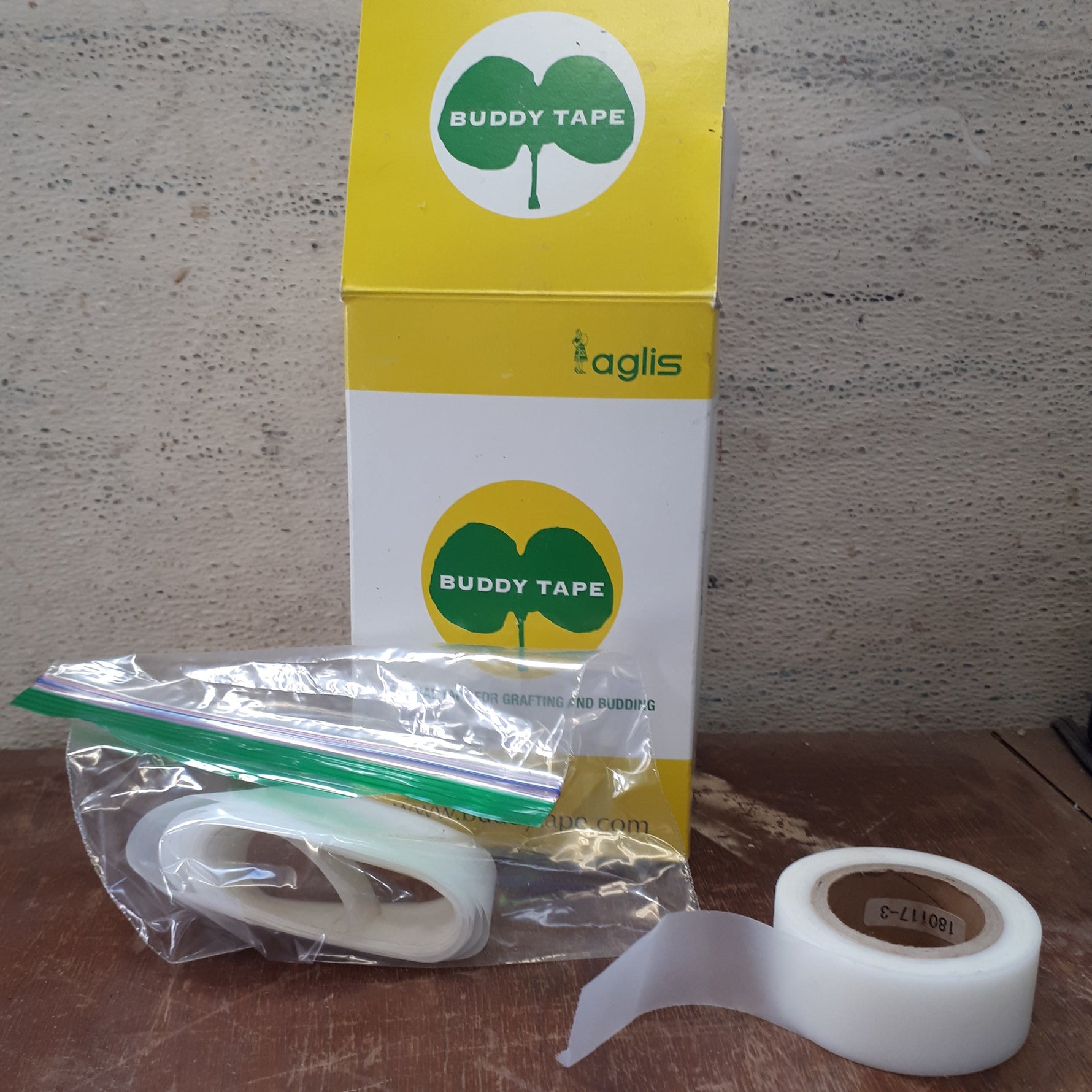 Grafting Tape box with grafting tape roll and bag of 50 grating tape pieces.