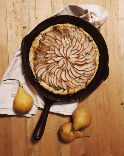 Bosc pear tarte sitting on a table.